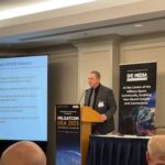 Mike Dean, Director, Command, Control and Communications Infrastructure (C3I) for DoD CIO speaks at MILSATCOM USA on June 17. (LJB)