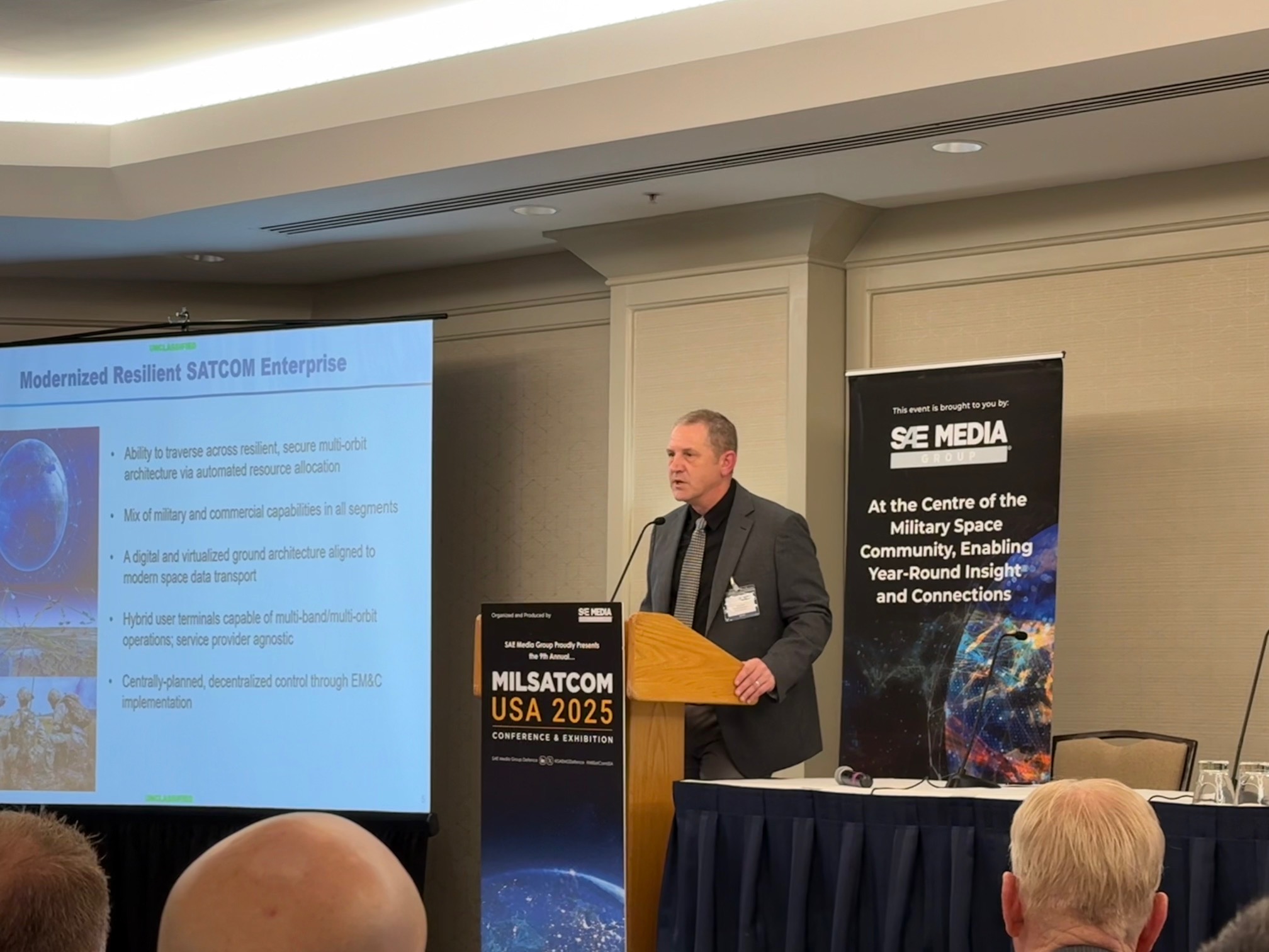 Mike Dean, Director, Command, Control and Communications Infrastructure (C3I) for DoD CIO speaks at MILSATCOM USA on June 17. (LJB)